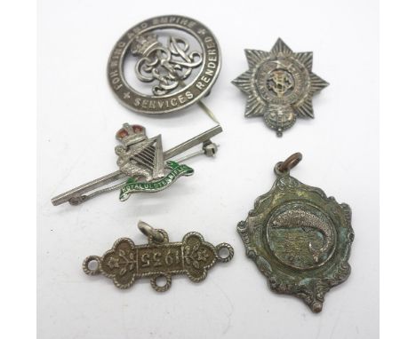 A silver War badge, 387238, a silver and enamel Royal Ulster Rifles badge, one other silver badge, etc.