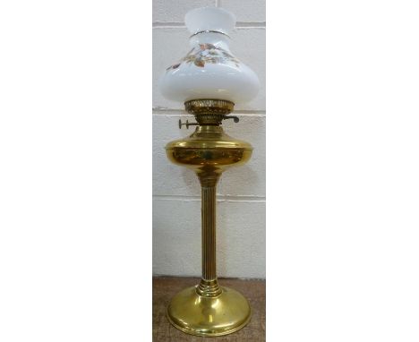 A brass column oil lamp, height 64cm