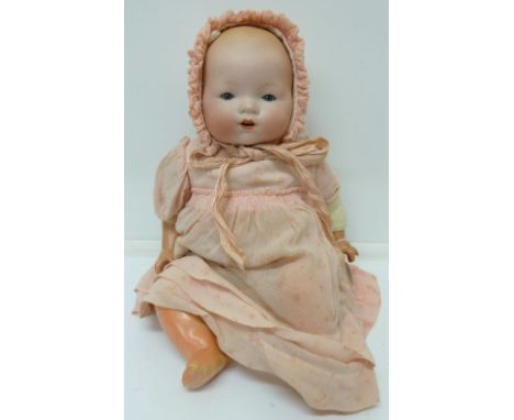 An Armand Marseille bisque-head baby doll, with blue sleeping eyes, 341, height 38cm