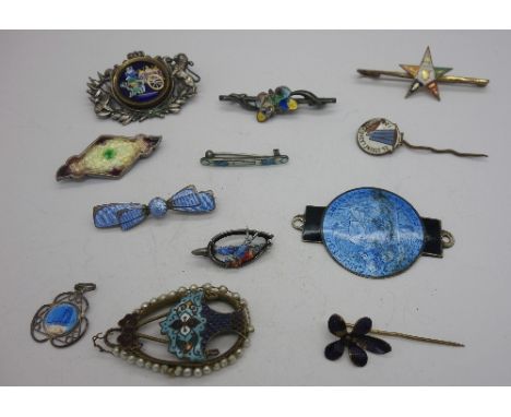 Silver and enamel brooches and a metal pendant, etc.
