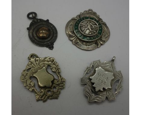Four fobs; two silver, one enamel Notts & Derby Boys Clubs and one other