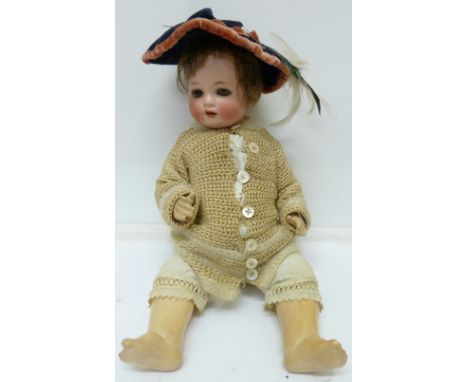 A German bisque head china doll, with blue sleeping eyes and eye lashes, height 41cm