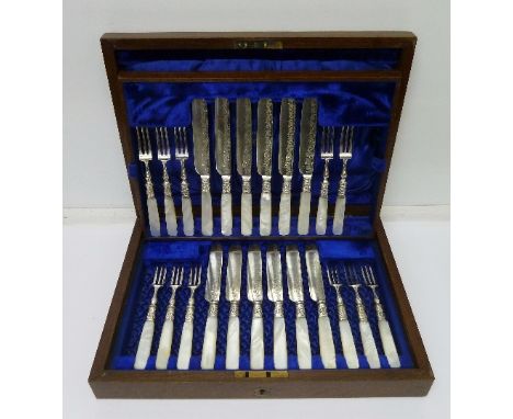 A cased set of twelve dessert knives and forks with mother of pearl handles