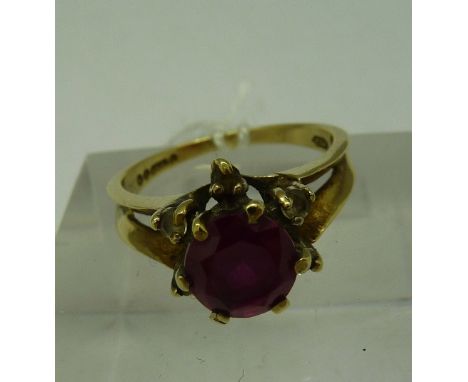 A 9ct gold and red stone ring, weight 2.6g, size K