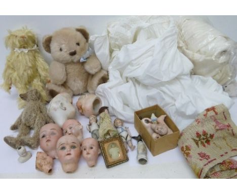 Three small bisque dolls, doll heads, parts, a Barbara Ann Teddy bear and two other Teddy bears and two christening gowns