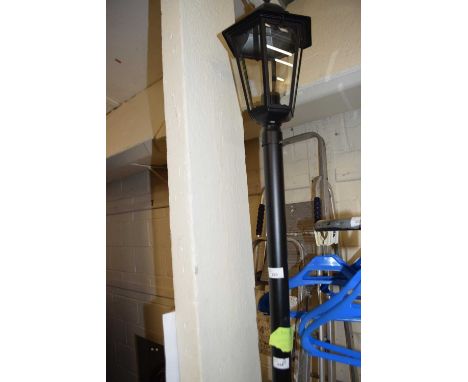 A modern garden light in the form of vintage street lamp