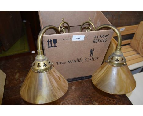 A two branch wall light with marble glass shades