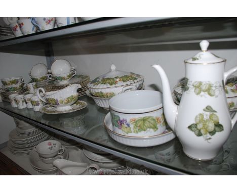 A Royal Worcester 'Vine Harvest' part Dinner/Coffee Service including two serving dishes with lids, souffle dish, two fruit b