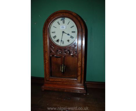A large Mantle Clock with key and pendulum (some damage to face)
