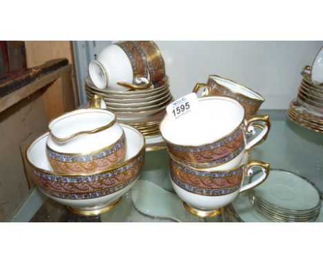 A pretty vintage gilded Roslyn part Teaset including six cups, saucers and tea plates, milk jug, sugar bowl and cake plate 