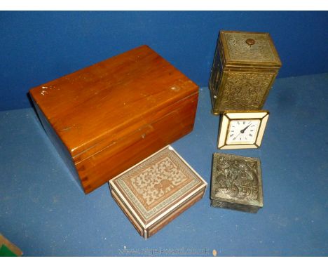 A brass tea caddy, two small boxes, bedside clock and a polished box