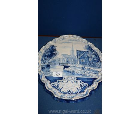 A 19th c/ Dutch Delft Plaque of canal and church scene, Makkum, Tichelaar, riveted to rear