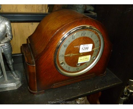 A Westminster chiming Mantle Clock retailed by Pleasance and Harper, Hereford