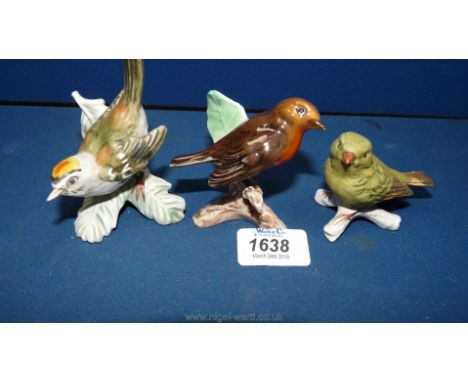 Three Goebel bird figurines; a robin, firecrest and a greenfinch