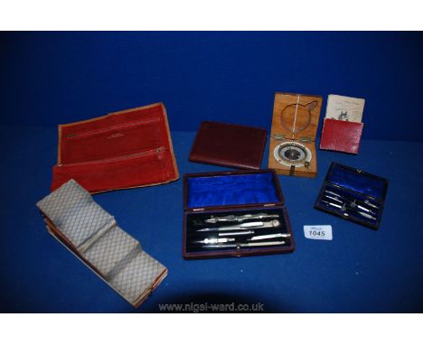 Two boxed drawing instruments, leather purse and jewellery roll, toy, cards and a wooden boxed compass