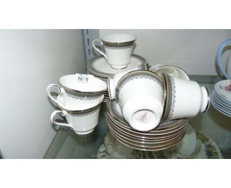 A Royal Doulton Teaset comprising seven cups, six saucers, tea plates and supper plates, in Braemar pattern