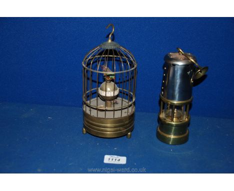A Brass Bird cage Clock and a Brass miner's Lamp