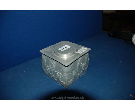 An Arts and Crafts Liberty style Square Tea Caddy with floral relief decoration in aluminium by N C Joseph of Stratford-on-Av