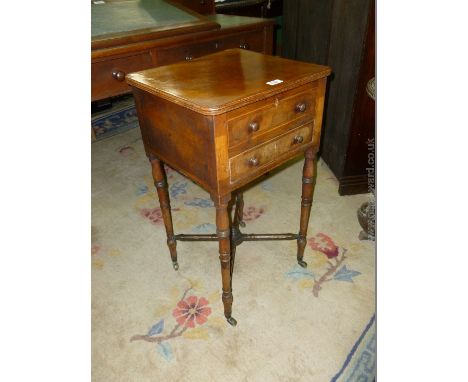 A pretty circa 1900 Mahogany night stand/sewing table having cross-banded and light-wood strung details, the front having a d