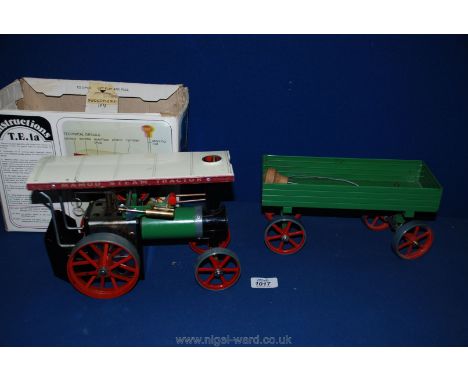 A Mamod TE 1A Traction Engine with original box, steering rod, drive belt, burner, etc., and a Mamod low-sided four wheeled W