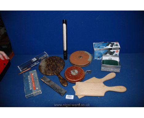 A quantity of miscellanea including 12 x 32 compact binoculars, pair of butter pats, fruit thermometer, two large tapes, new 