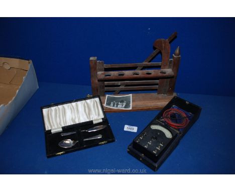 A Presentation cased e.p.n.s. preserve spoon and butter knife and a cased "Avo Minor" electrical tester with leads and a five