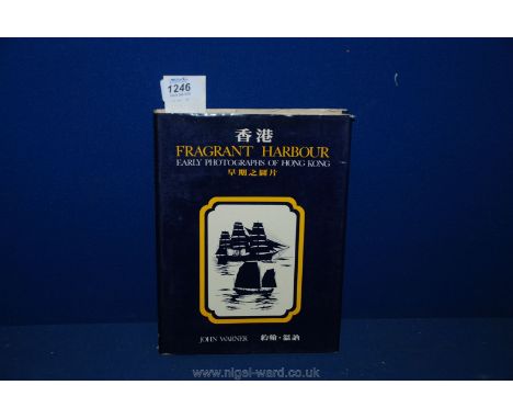 A first edition Book "Fragrant Harbour Early Photographs of Hong Kong" by John Warner, signed.
