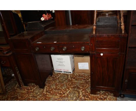A late 19th c. Mahogany Sideboard having step top with two central frieze drawers, the pedestal base having upper small singl