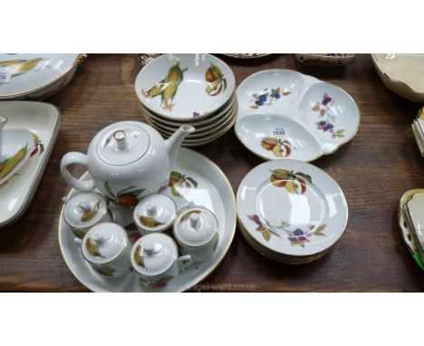 A quantity of Royal Worcester 'Evesham' items including five chocolate cups, flan dish, small teapot, five side plates, six d