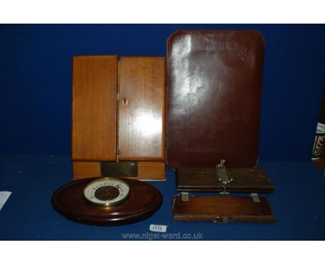 A quantity of Treen including presentation wooden letter rack, two tie presses, wall barometer and a leather briefcase