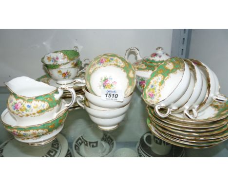 A Paragon ''Pompadour'' bone china Teaset including teapot, eight cups and saucers, six plates, jug, sugar bowl and two bread