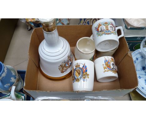A Bell's porcelain Decanter together with five commemorative mugs