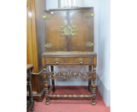 XX Century Oak Drinks Cabinet, with a brass lock plate, brass hinges, single drawer, with carved decoration, centre rail with