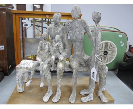 Plaster Figure Group, of five people seated on and stood by bench, 38cm high (damages) with wooden stand.