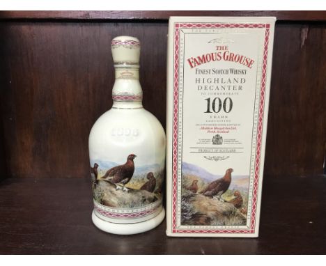 FAMOUS GROUSE CENTENARY DECANTER Blended Scotch Whisky. 70cl, 40% volume, in Wade decanter gilded with 24 carat gold, in cart
