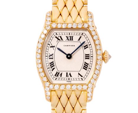 CARTIER seltene und hochfeine Tourtue "Factory Diamonds" Damenuhr. Aus 1988. Gelbgold 18K, Gehäuse besetzt mit 52 Brillanten,