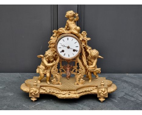 A gilt painted spelter mantel clock,&nbsp;38.5cm wide, with pendulum.