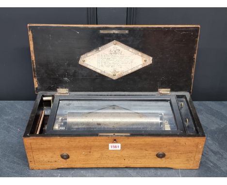 An early 20th century Swiss walnut music box,&nbsp;playing eight airs, with 27.5cm cylinder, the lever numbered 36843, 50cm w