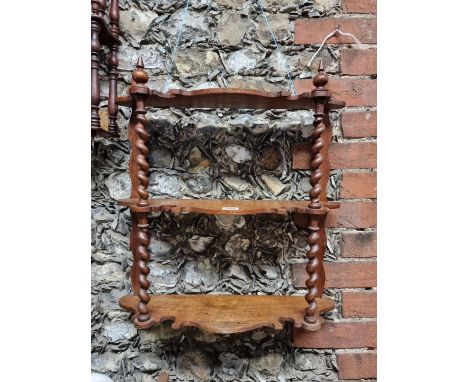 An old oak hanging shelf,&nbsp;51cm wide; together with another smaller mahogany example. (2)