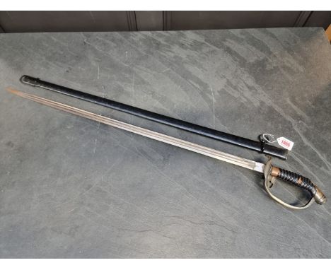 An Imperial German model 1889 Prussian officer's sword and scabbard, by W K &amp; C, with 80cm double fullered blade.