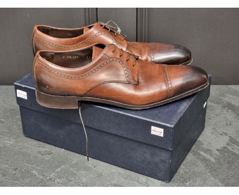 Prada:&nbsp;a pair of men's burnished brown leather lace-up shoes, UK11, with dustbags and box (splits to lid). All proceeds 