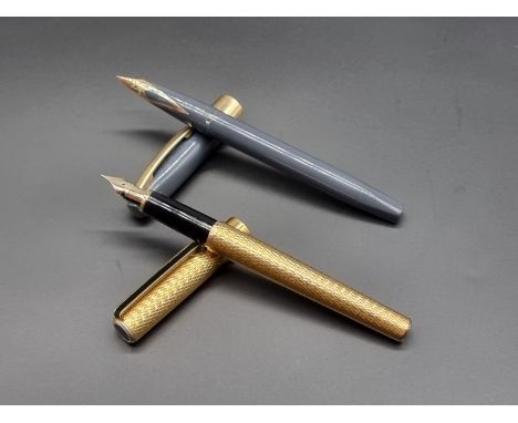 A Sheaffer Imperial 'white dot' fountain pen, with 14k gold nib; together with a Sailor engine turned gilt metal fountain pen