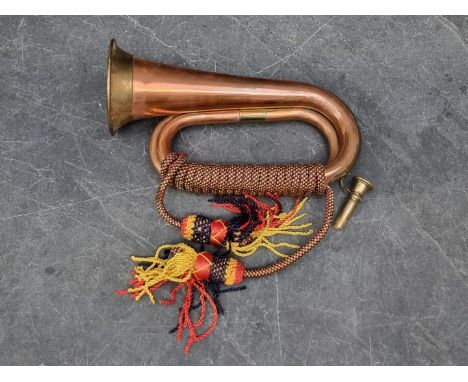 A copper and brass bugle. 