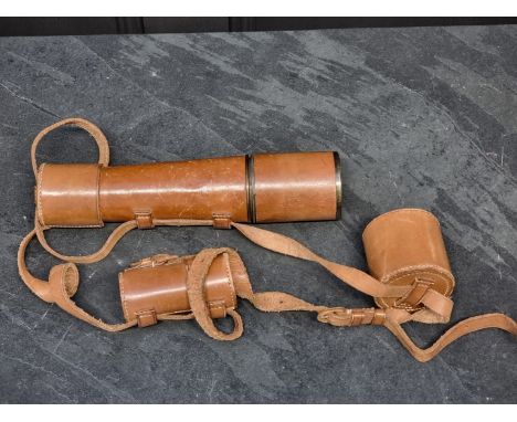 A leather and lacquered brass three drawer telescope,&nbsp;81cm extended.