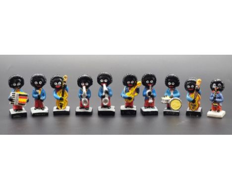 Robertson's: a group of 9 chalk or pottery band figures; together with another similar. Notice from the the-saleroom.com: The