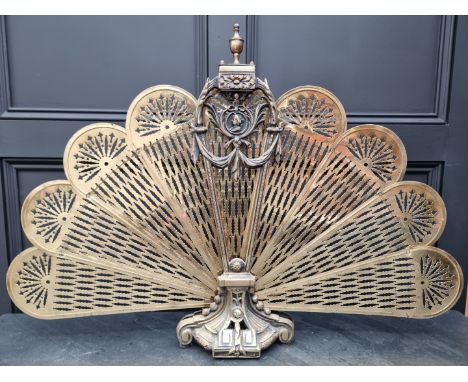 A brass fan-form folding fireguard, 96.5cm wide.