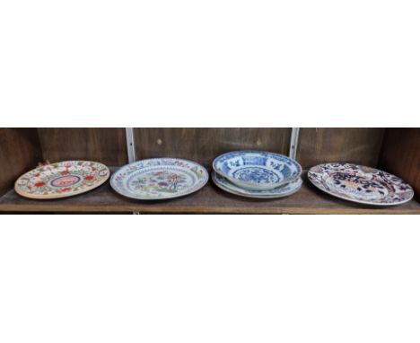 Three late 18th century Chinese blue and white plates; together with a pair of Spode creamware 'Crazy Cow' pattern plates; an