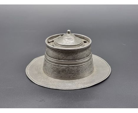 A 19th century Chinese pewter capstan inkwell, 15cm diameter.
