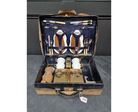 A vintage blue leather cased picnic set,&nbsp;with Mintons porcelain and gilt metal fittings.