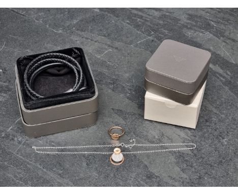 Emporio Armani:&nbsp;a brown leather double strand plaited bracelet, in box; together with a boxed necklace and ring set.&nbs
